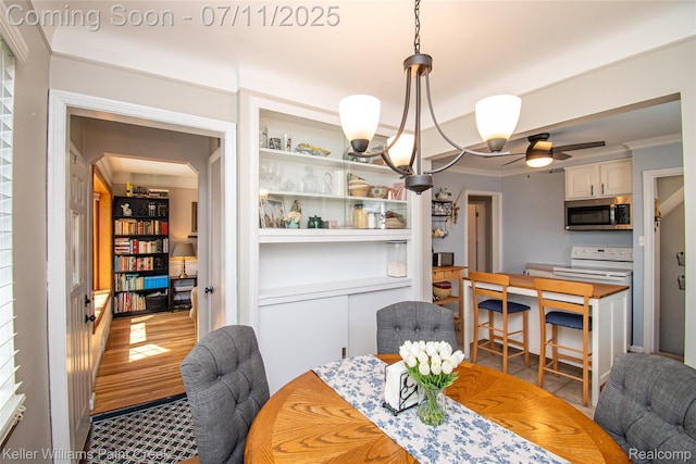 1968 Oxford Rd, Grosse Pointe Woods, MI 48236 - dining area featuring built in shelves, crown molding, and ceiling fan