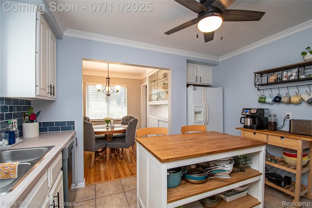 1968 Oxford Rd, Grosse Pointe Woods, MI 48236 - kitchen with white refrigerator with ice dispenser, wood counters, open shelves, white cabinetry, and ornamental molding