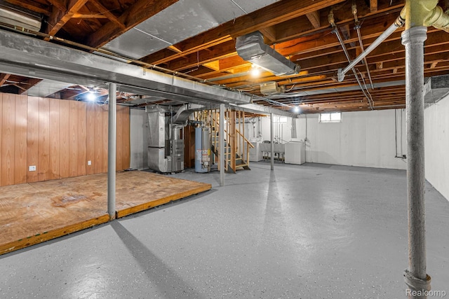 808 Pagel Ave, Lincoln Park, MI 48146 - basement with washer and dryer, gas water heater, stairs, heating unit, and wood walls