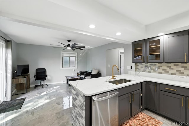 17652 Robert St, Melvindale, MI 48122 - kitchen with stainless steel dishwasher, decorative backsplash, a peninsula, light stone countertops, and ceiling fan