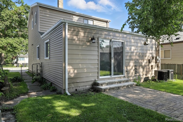 17652 Robert St, Melvindale, MI 48122 - rear view of house featuring entry steps and a chimney
