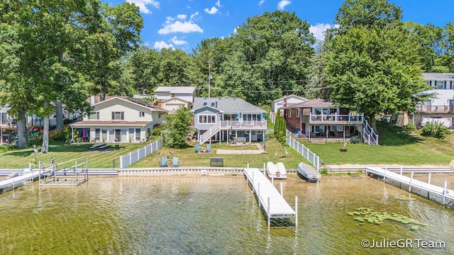 11986 Reyburn Dr NE, Sparta, MI 49345 - dock area featuring stairs, a deck with water view, a yard, and a residential view