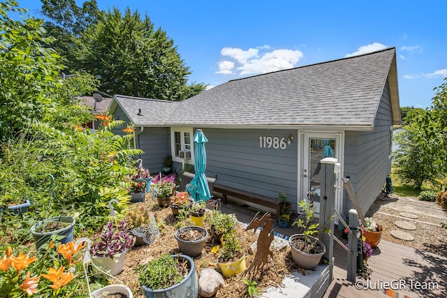 11986 Reyburn Dr NE, Sparta, MI 49345 - back of house featuring a shingled roof