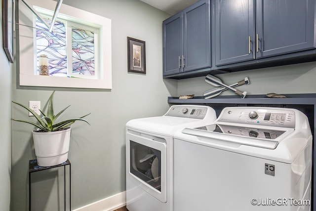 11986 Reyburn Dr NE, Sparta, MI 49345 - laundry room featuring independent washer and dryer and cabinet space