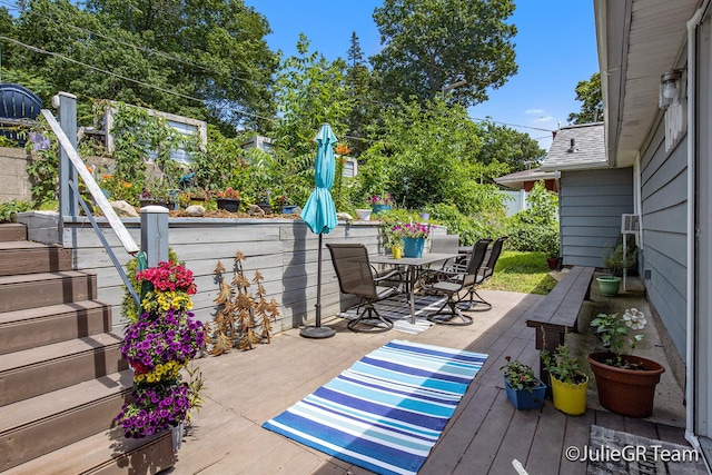 11986 Reyburn Dr NE, Sparta, MI 49345 - view of patio / terrace with outdoor dining space and a wooden deck