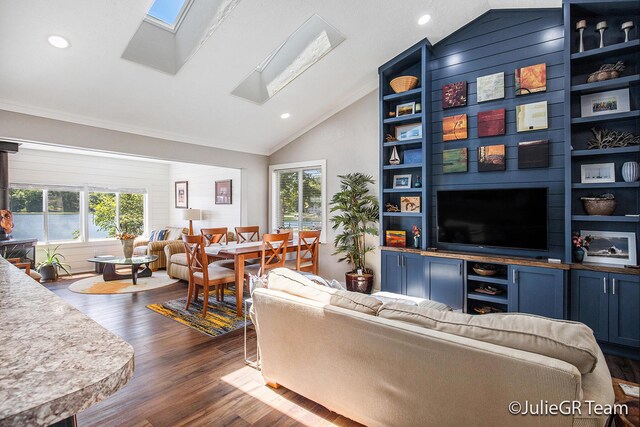 11986 Reyburn Dr NE, Sparta, MI 49345 - living area featuring vaulted ceiling, a skylight, healthy amount of natural light, dark wood-style flooring, and recessed lighting