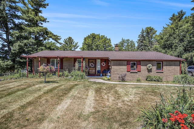 3706 Northview Dr, Kalamazoo, MI 49004 - single story home featuring covered porch, brick siding, a front lawn, and a chimney
