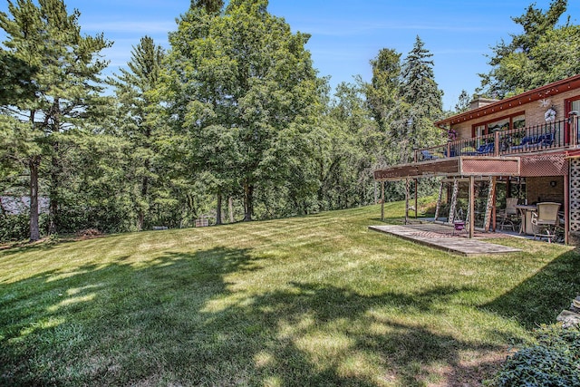 3706 Northview Dr, Kalamazoo, MI 49004 - view of green lawn with a deck and a patio area
