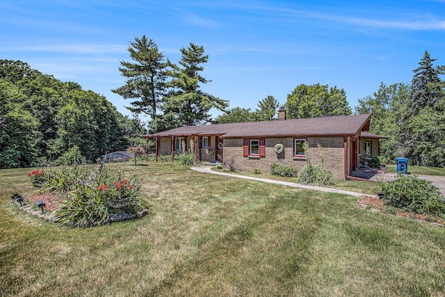 3706 Northview Dr, Kalamazoo, MI 49004 - ranch-style home with a front lawn, a chimney, and brick siding