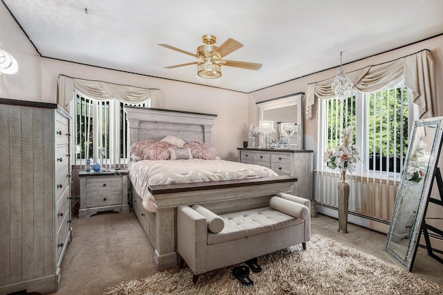 3706 Northview Dr, Kalamazoo, MI 49004 - carpeted bedroom with a baseboard heating unit and a ceiling fan