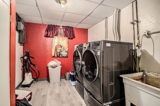 3706 Northview Dr, Kalamazoo, MI 49004 - washroom featuring washing machine and clothes dryer and wood finished floors