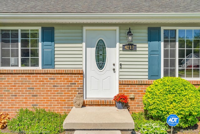 4217 Tristen Ave, Fort Gratiot, MI 48059 - doorway to property with brick siding and a shingled roof