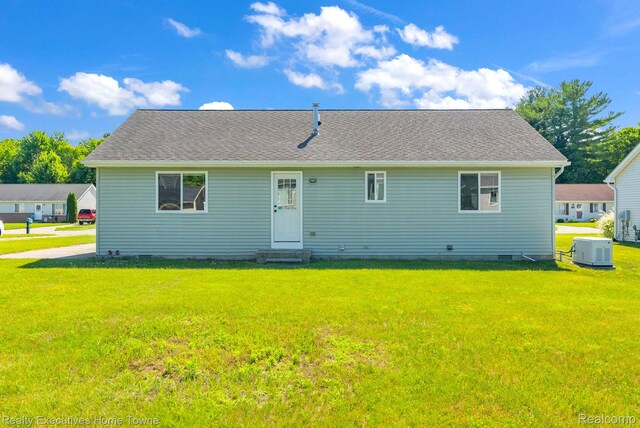 4217 Tristen Ave, Fort Gratiot, MI 48059 - back of property with entry steps, a yard, and crawl space