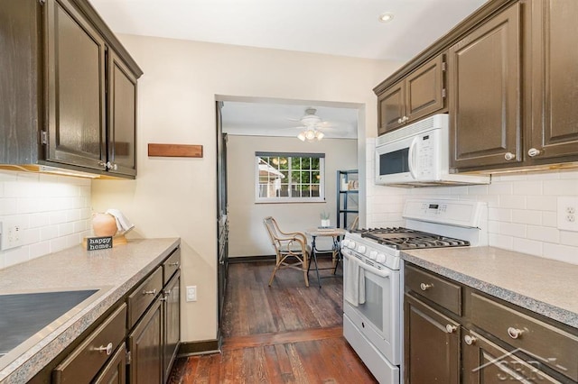 2220 Mershon St, Saginaw, MI 48602 - kitchen with white appliances, dark wood-style floors, backsplash, and a ceiling fan