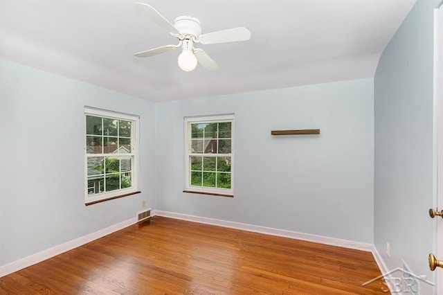 2220 Mershon St, Saginaw, MI 48602 - empty room featuring wood finished floors and ceiling fan