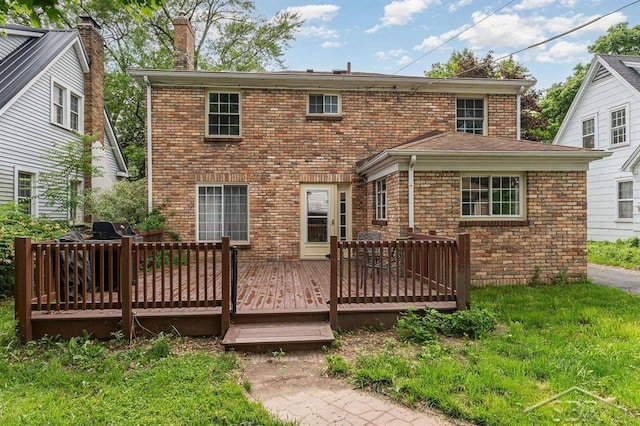 2220 Mershon St, Saginaw, MI 48602 - rear view of property with brick siding, a chimney, and a wooden deck