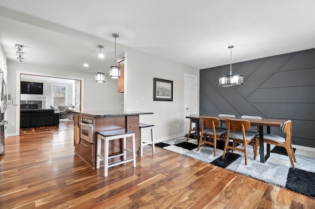 5643 E C Ave, Richland, MI 49083 - dining area with wood finished floors and a decorative wall