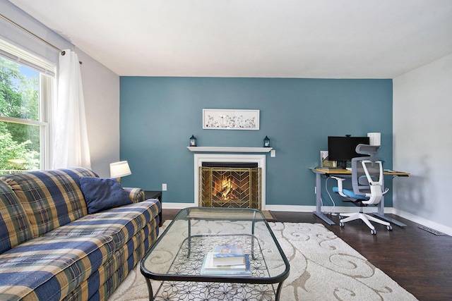 7981 Faircrest Dr, Ypsilanti, MI 48197 - living area with wood finished floors and a lit fireplace