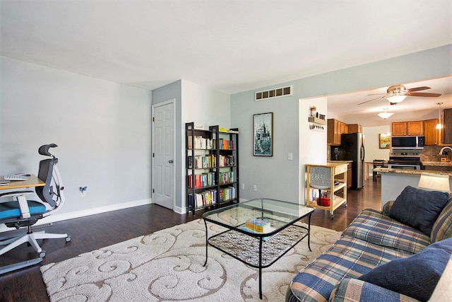 7981 Faircrest Dr, Ypsilanti, MI 48197 - living room featuring dark wood-type flooring, a desk, and a ceiling fan