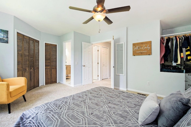 7981 Faircrest Dr, Ypsilanti, MI 48197 - carpeted bedroom with multiple closets and a ceiling fan