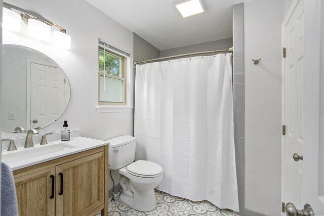 7981 Faircrest Dr, Ypsilanti, MI 48197 - bathroom with vanity, a shower with curtain, and tile patterned flooring
