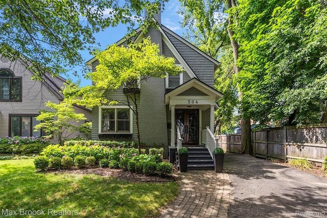 504 Landon St, Birmingham, MI 48009 - view of front facade featuring a chimney and brick siding