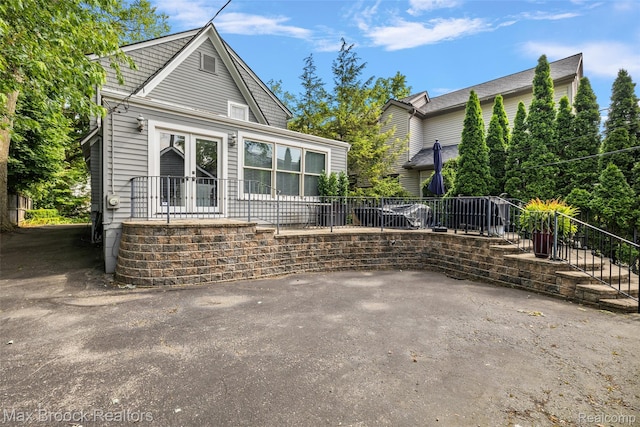 504 Landon St, Birmingham, MI 48009 - view of front facade with french doors and a patio