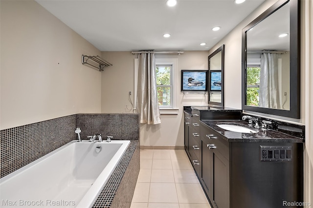 504 Landon St, Birmingham, MI 48009 - bathroom featuring vanity, a garden tub, tile patterned floors, and recessed lighting