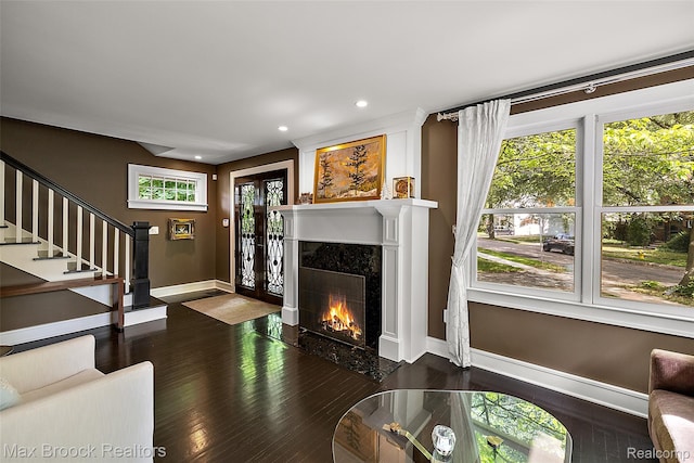 504 Landon St, Birmingham, MI 48009 - living area featuring dark wood-style floors, a premium fireplace, stairway, and recessed lighting