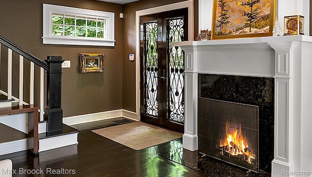 504 Landon St, Birmingham, MI 48009 - entryway featuring wood finished floors, a high end fireplace, and stairway