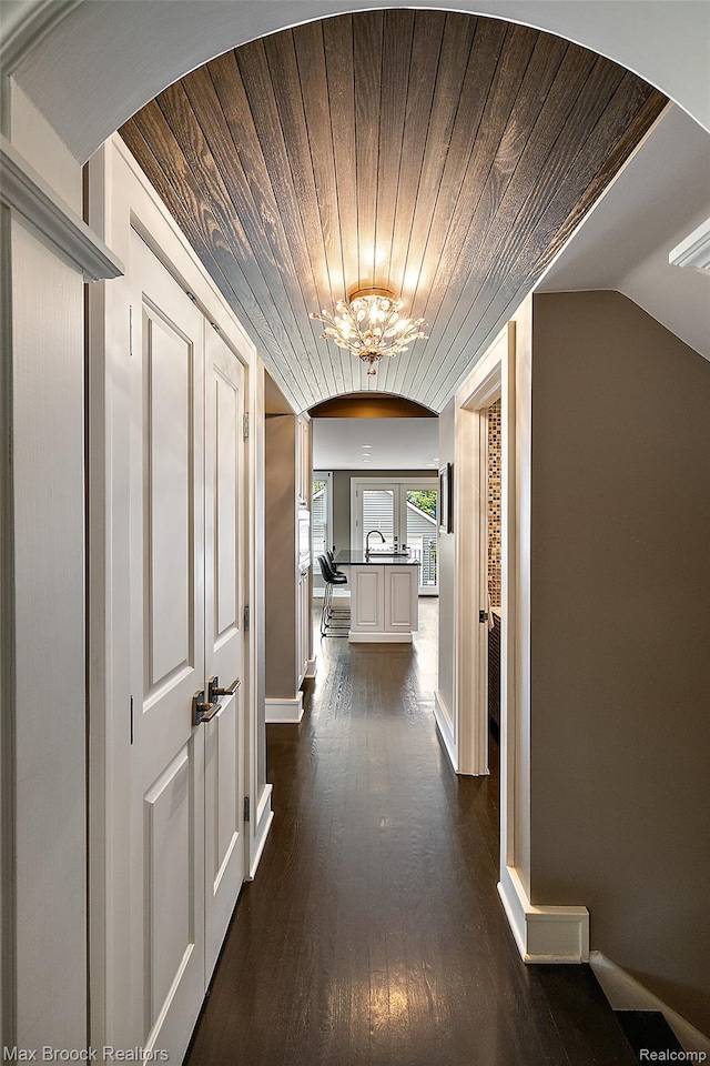 504 Landon St, Birmingham, MI 48009 - hall with wood ceiling, dark wood-type flooring, and a chandelier