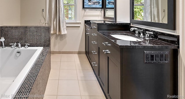 504 Landon St, Birmingham, MI 48009 - bathroom with vanity, tile patterned floors, and a bath
