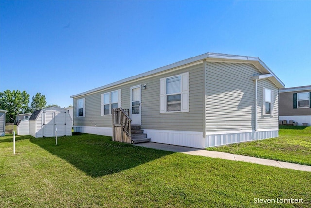 947 Redwood Dr, Hastings, MI 49058 - back of house with a storage shed and a yard