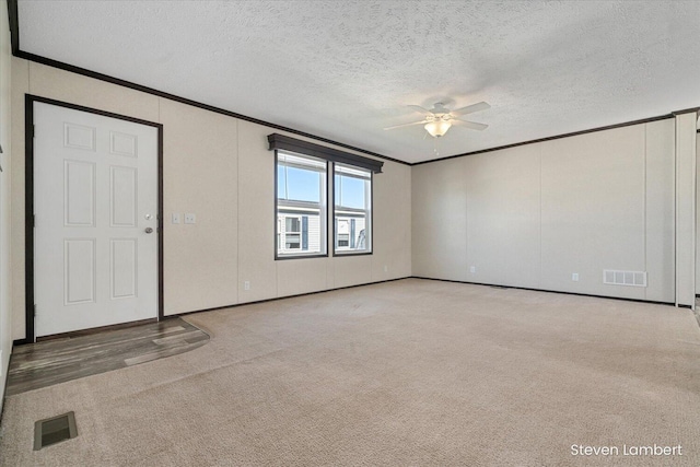 947 Redwood Dr, Hastings, MI 49058 - carpeted empty room with ornamental molding, ceiling fan, and a textured ceiling