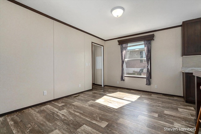 947 Redwood Dr, Hastings, MI 49058 - unfurnished dining area featuring ornamental molding and wood finished floors