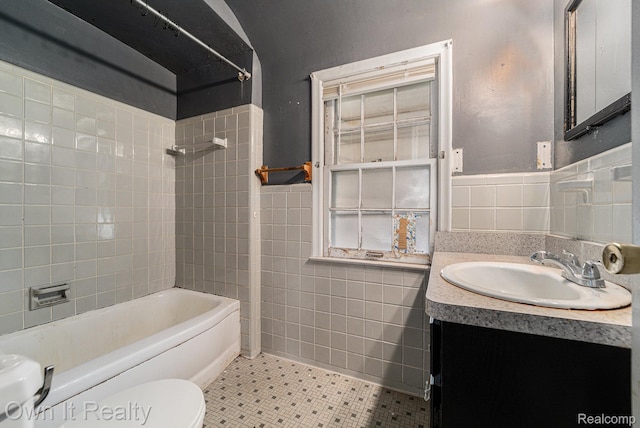 74 Chestnut St, River Rouge, MI 48218 - bathroom featuring tile walls, vanity, shower / bath combination, and wainscoting