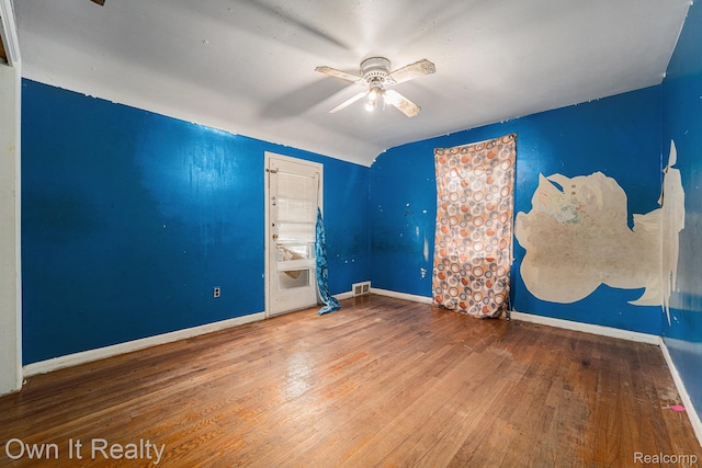 74 Chestnut St, River Rouge, MI 48218 - spare room featuring wood finished floors, ceiling fan, and vaulted ceiling