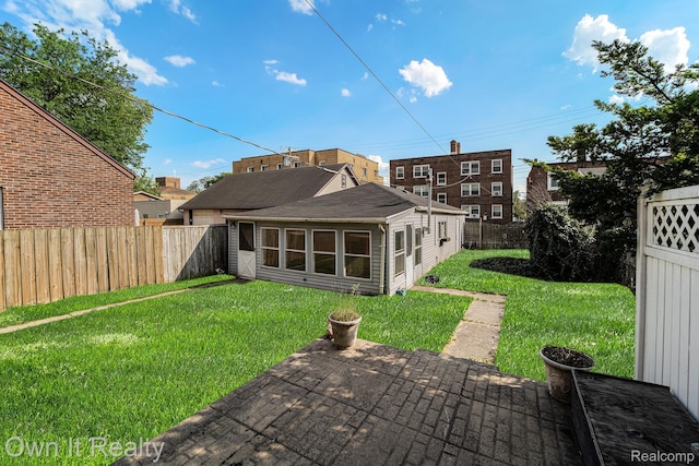 74 Chestnut St, River Rouge, MI 48218 - rear view of house featuring a fenced backyard and a patio