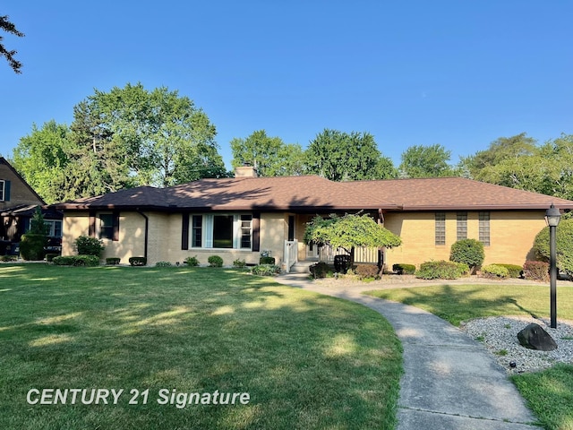 1751 Lathrup Ave, Saginaw, MI 48638 - ranch-style home with a front lawn and a chimney
