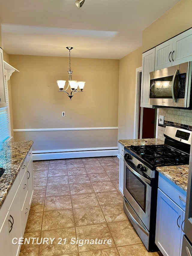 1751 Lathrup Ave, Saginaw, MI 48638 - kitchen with stainless steel appliances, a baseboard heating unit, backsplash, a chandelier, and light stone counters