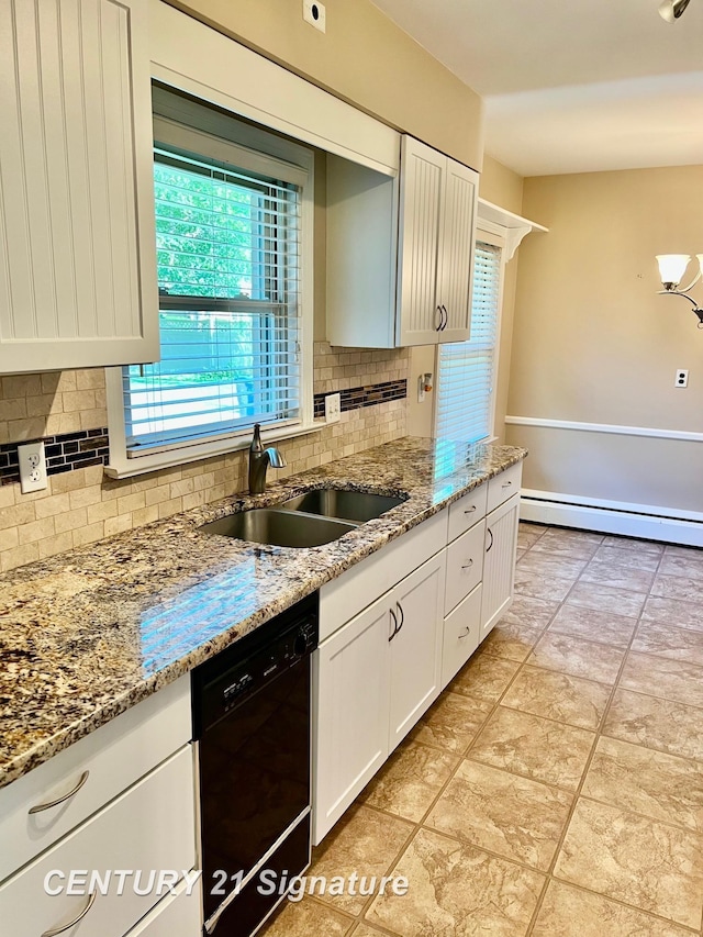 1751 Lathrup Ave, Saginaw, MI 48638 - kitchen featuring black dishwasher, a baseboard radiator, decorative backsplash, and light stone countertops