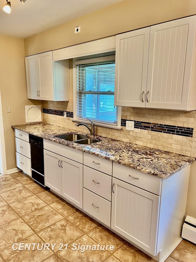 1751 Lathrup Ave, Saginaw, MI 48638 - kitchen with backsplash, light stone counters, and white cabinets