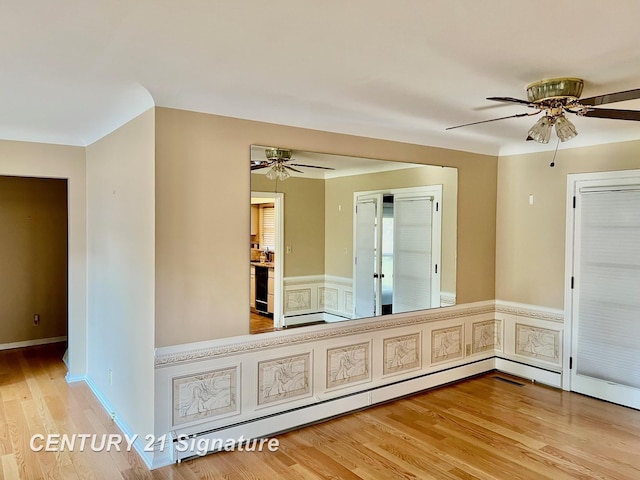 1751 Lathrup Ave, Saginaw, MI 48638 - spare room with ceiling fan, wood finished floors, and wainscoting