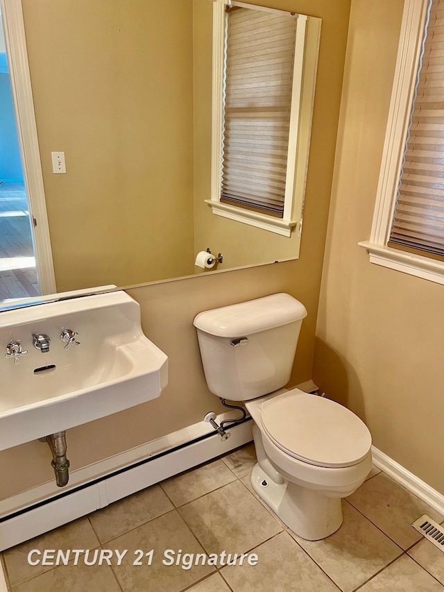 1751 Lathrup Ave, Saginaw, MI 48638 - half bath with tile patterned flooring and baseboard heating