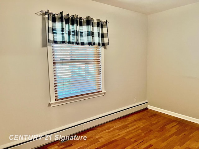 1751 Lathrup Ave, Saginaw, MI 48638 - unfurnished room with a baseboard radiator and wood finished floors