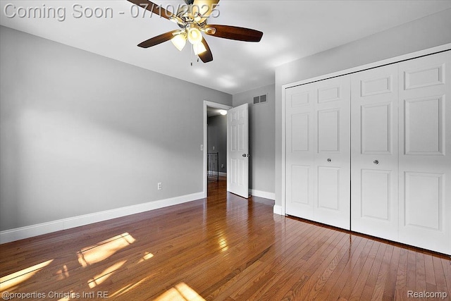 25426 Lindenwood Ln, Southfield, MI 48033 - unfurnished bedroom featuring a closet, hardwood / wood-style flooring, and a ceiling fan