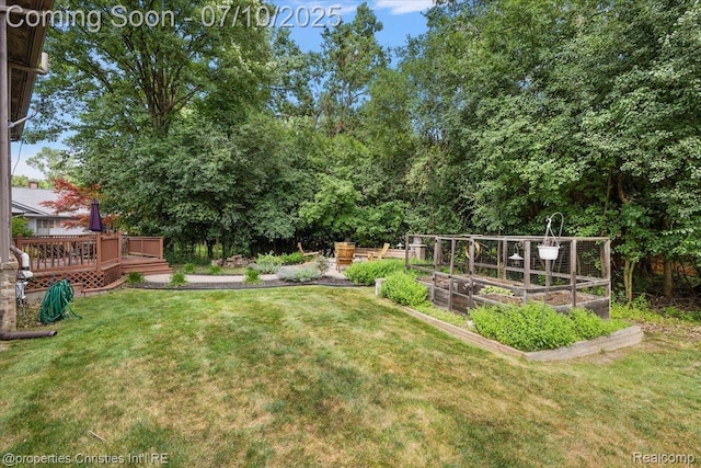 25426 Lindenwood Ln, Southfield, MI 48033 - view of grassy yard featuring a garden and a wooden deck