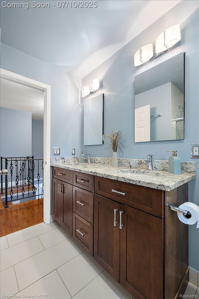 25426 Lindenwood Ln, Southfield, MI 48033 - bathroom featuring double vanity and tile patterned floors