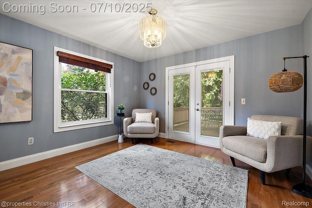 25426 Lindenwood Ln, Southfield, MI 48033 - sitting room with a chandelier, french doors, and wood finished floors