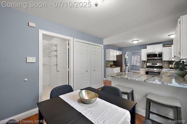 25426 Lindenwood Ln, Southfield, MI 48033 - dining room featuring baseboards